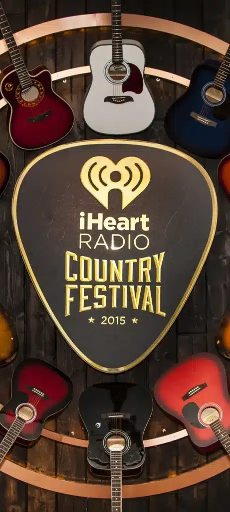 wood background with guitars hanging in a circle